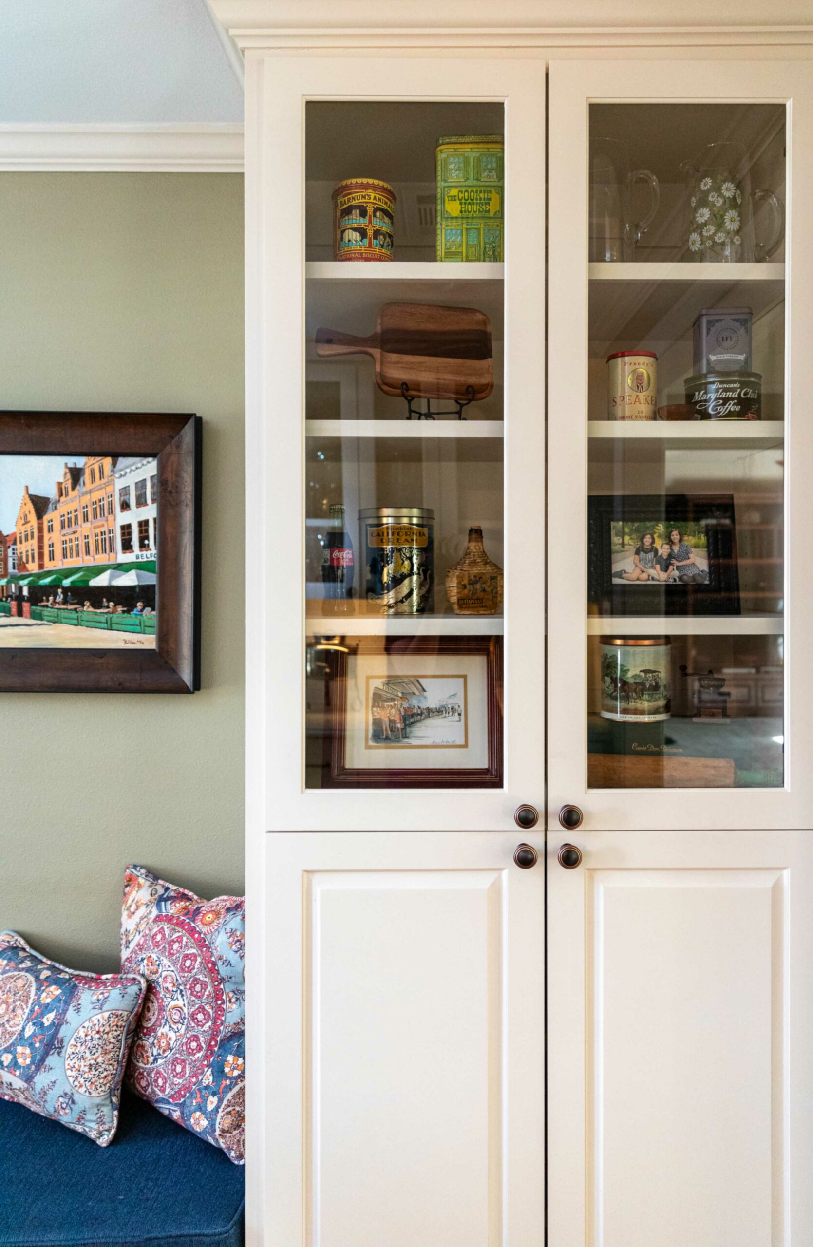 glass-and-wood-pantry-cabinet-next-to-built-in-banquette